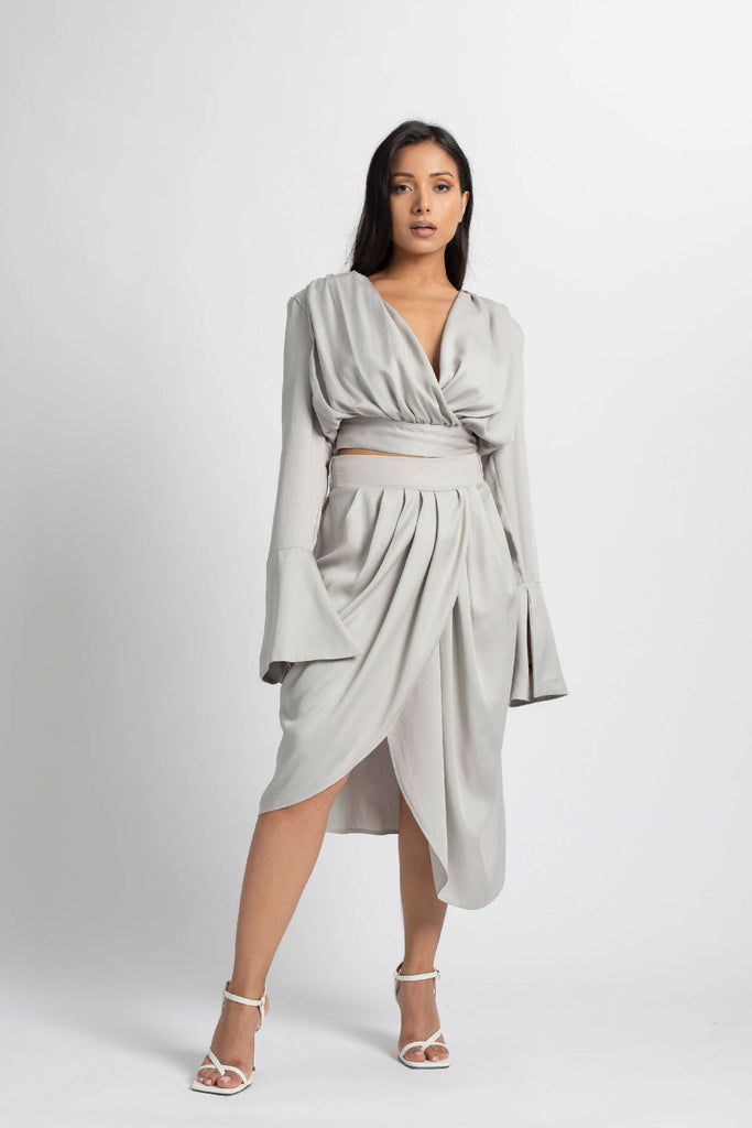 PLEATED SKIRT WITH ASYMMETRICAL OVERLAPPING