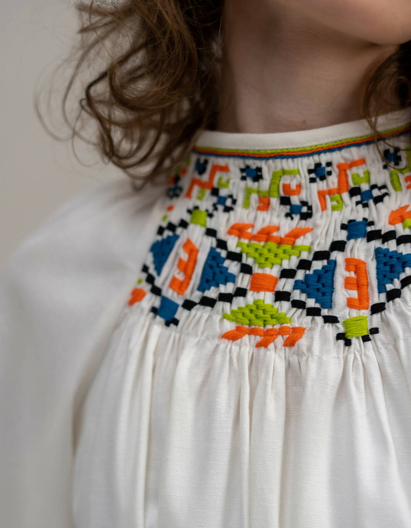 Dress with geometric embroidery